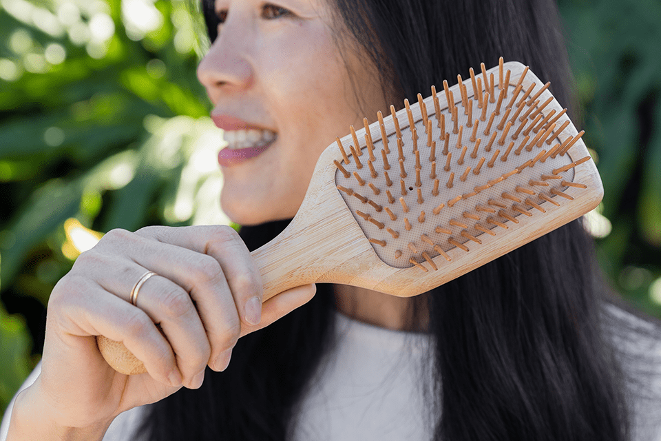 Hack Your Way to a Zero Waste Kitchen With These Easy Swaps DEC2024_ZWS_ProductwithModels_BambooHairBrush-2.png__PID:497741e2-fc9f-476c-9aa1-d90d35d680a1