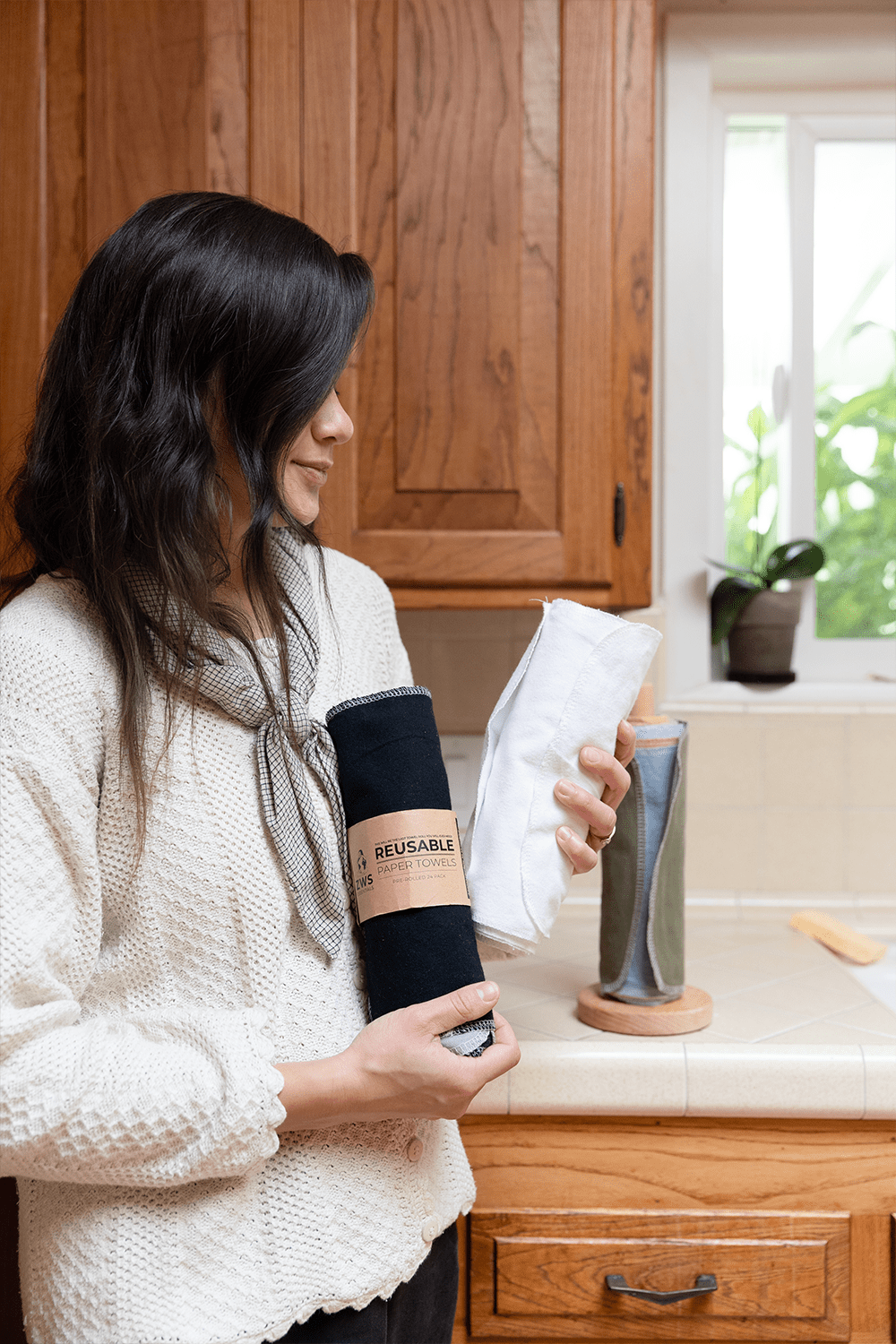 girl holding reusable paper towels