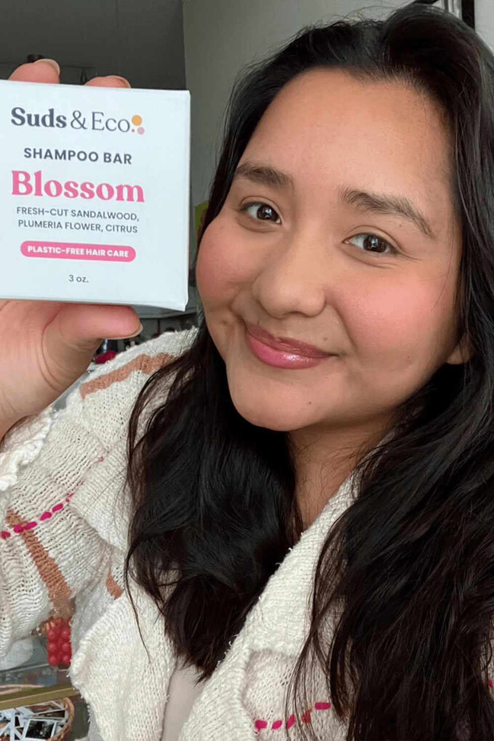 girl showcasing shampoo bar girl showcasing shampoo bar