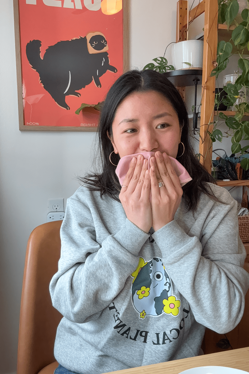 girl wiping her face with reusable paper-towels