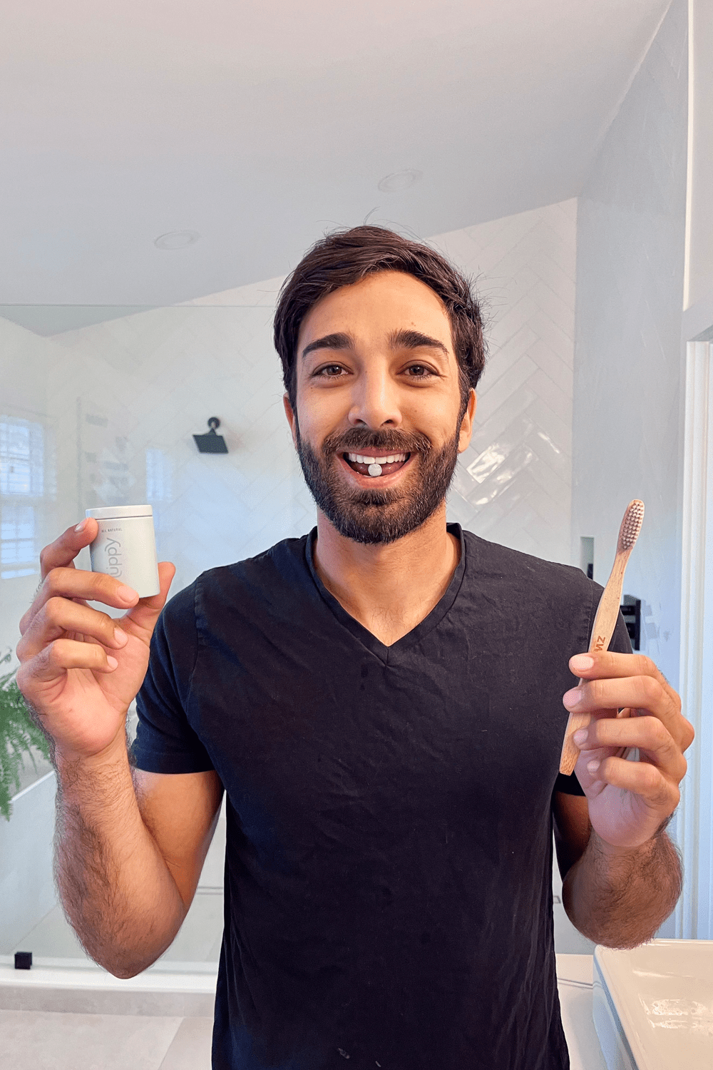 man holding bamboo toothbrush man holding bamboo toothbrush