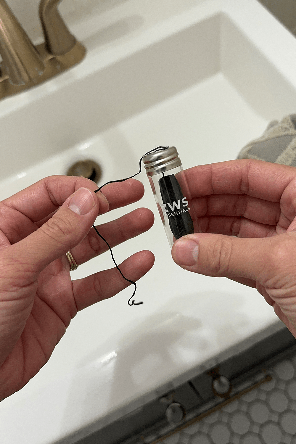 model holding bamboo charcoal floss